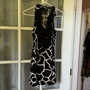 Adorable SHORT giraffe print dress. Worn once.